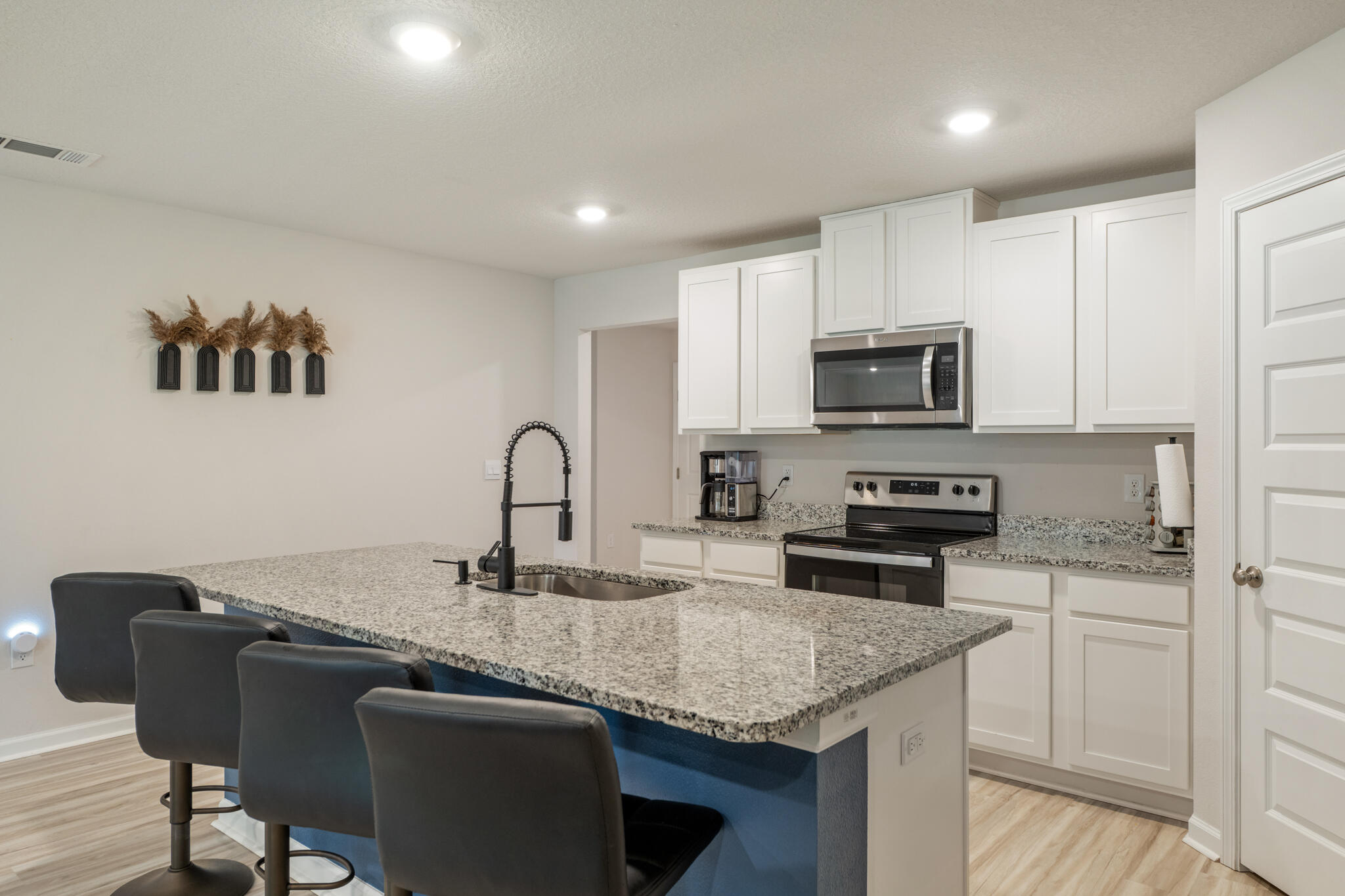 810 Otto Loop Crestview, FL 32539 - Photo 16 of 41 a kitchen with granite countertop a sink cabinets and stainless steel appliances