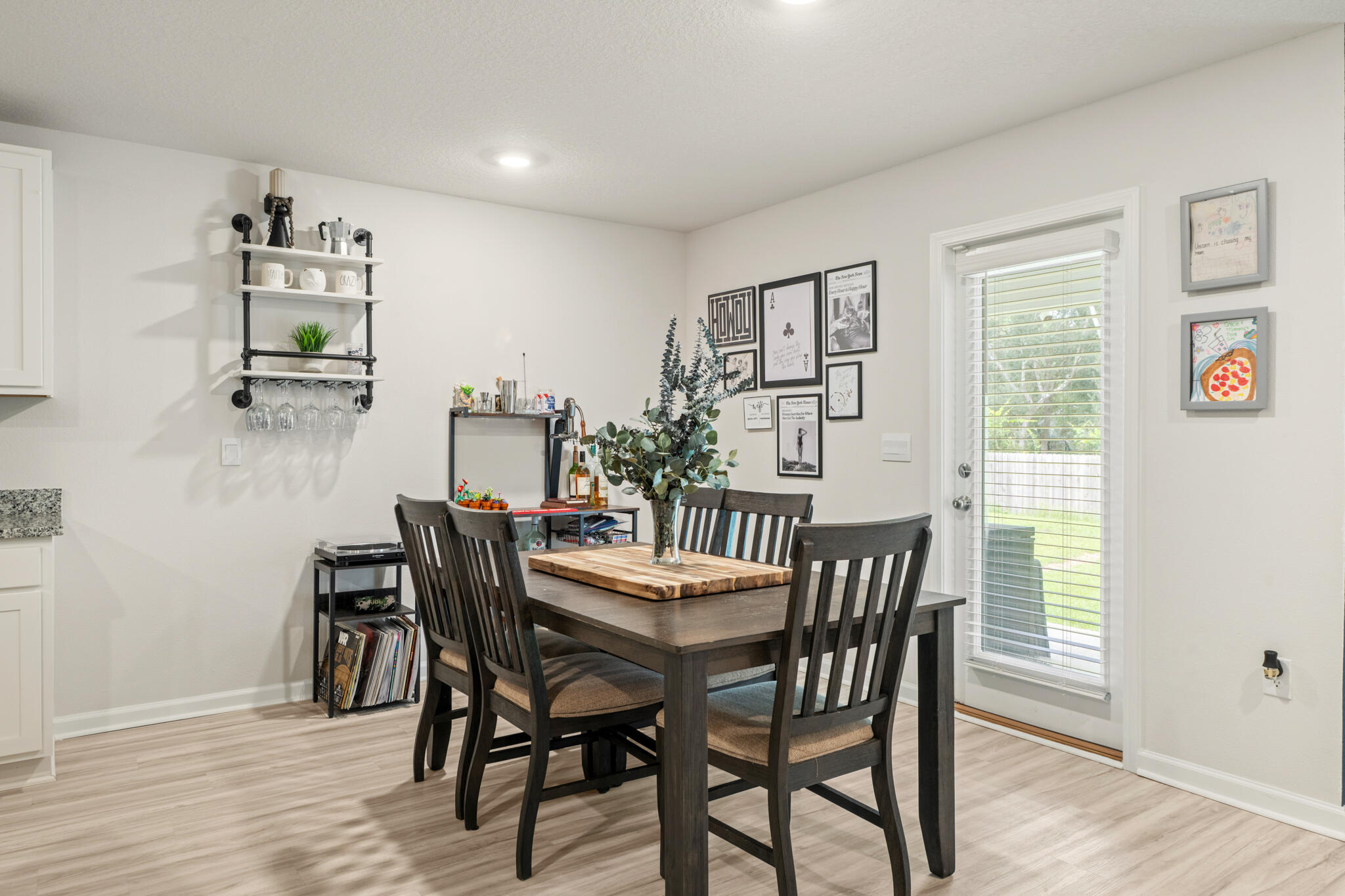 810 Otto Loop Crestview, FL 32539 - Photo 18 of 41 a view of a dining room with furniture and wooden floor