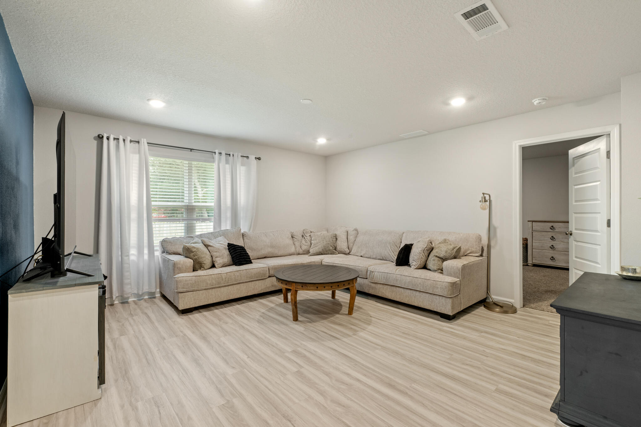 810 Otto Loop Crestview, FL 32539 - Photo 20 of 41 a living room with furniture and a flat screen tv