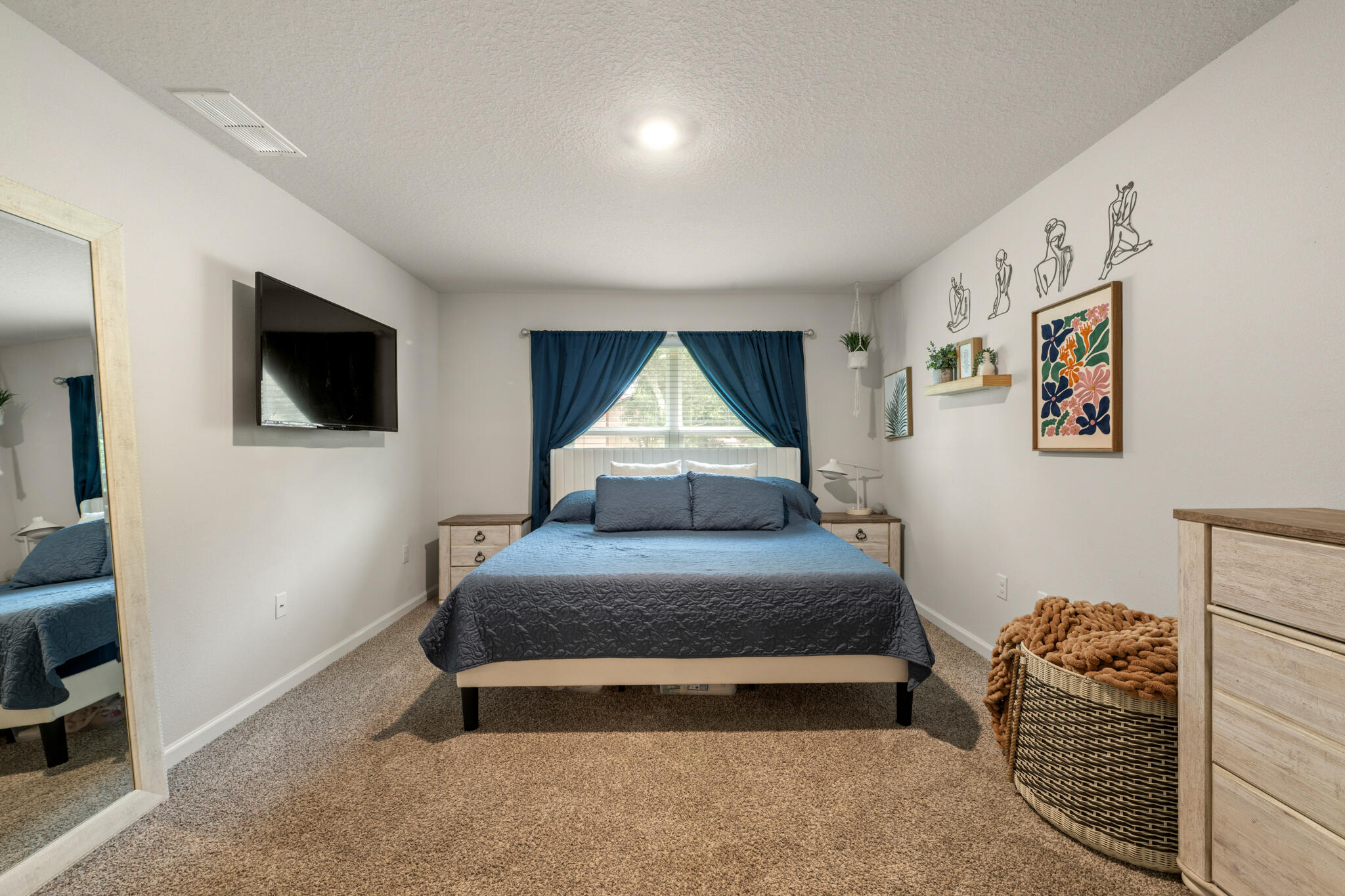 810 Otto Loop Crestview, FL 32539 - Photo 24 of 41 a spacious bedroom with a bed and a flat screen tv