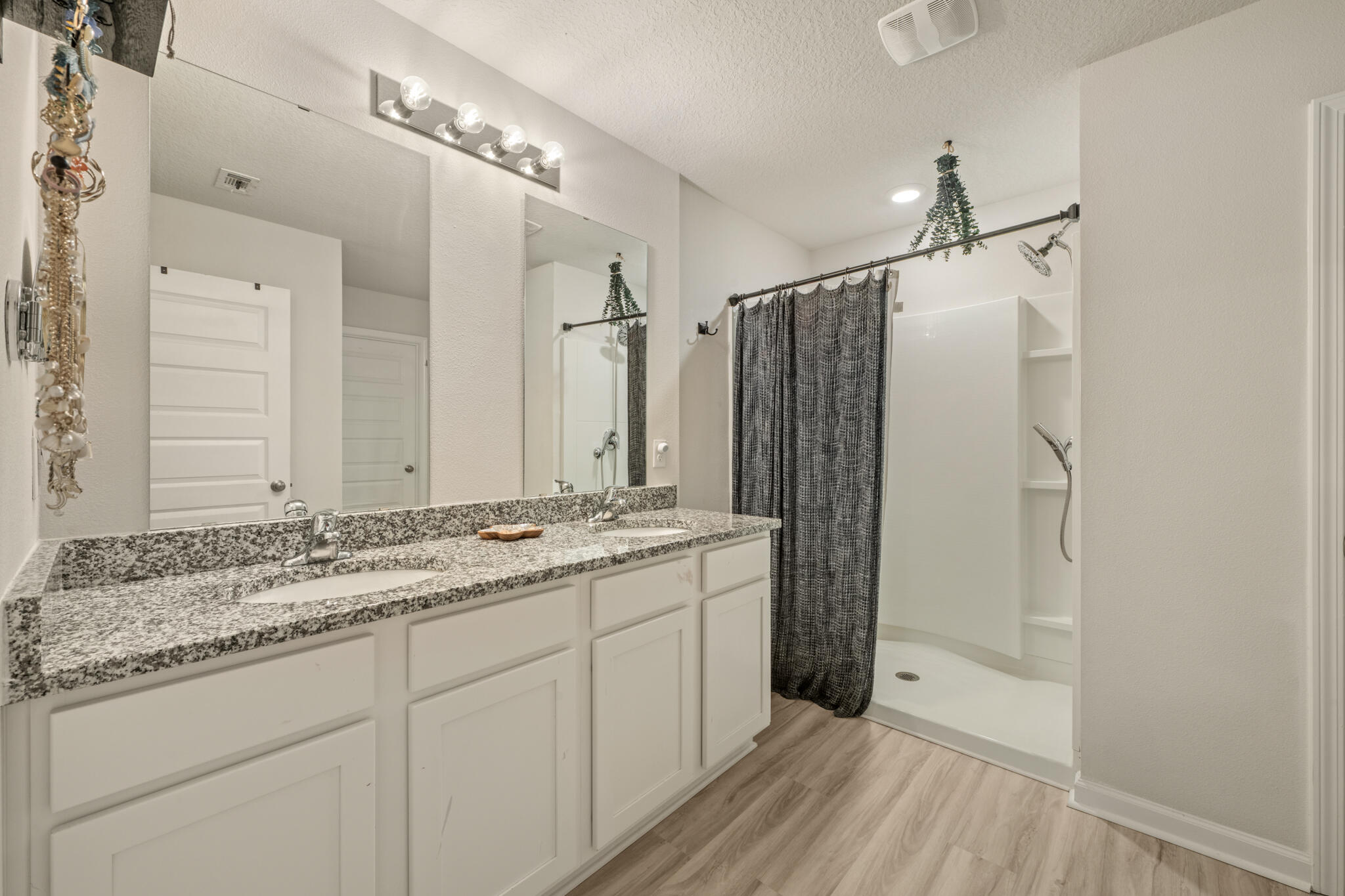 810 Otto Loop Crestview, FL 32539 - Photo 25 of 41 a bathroom with a granite countertop shower sink and mirror