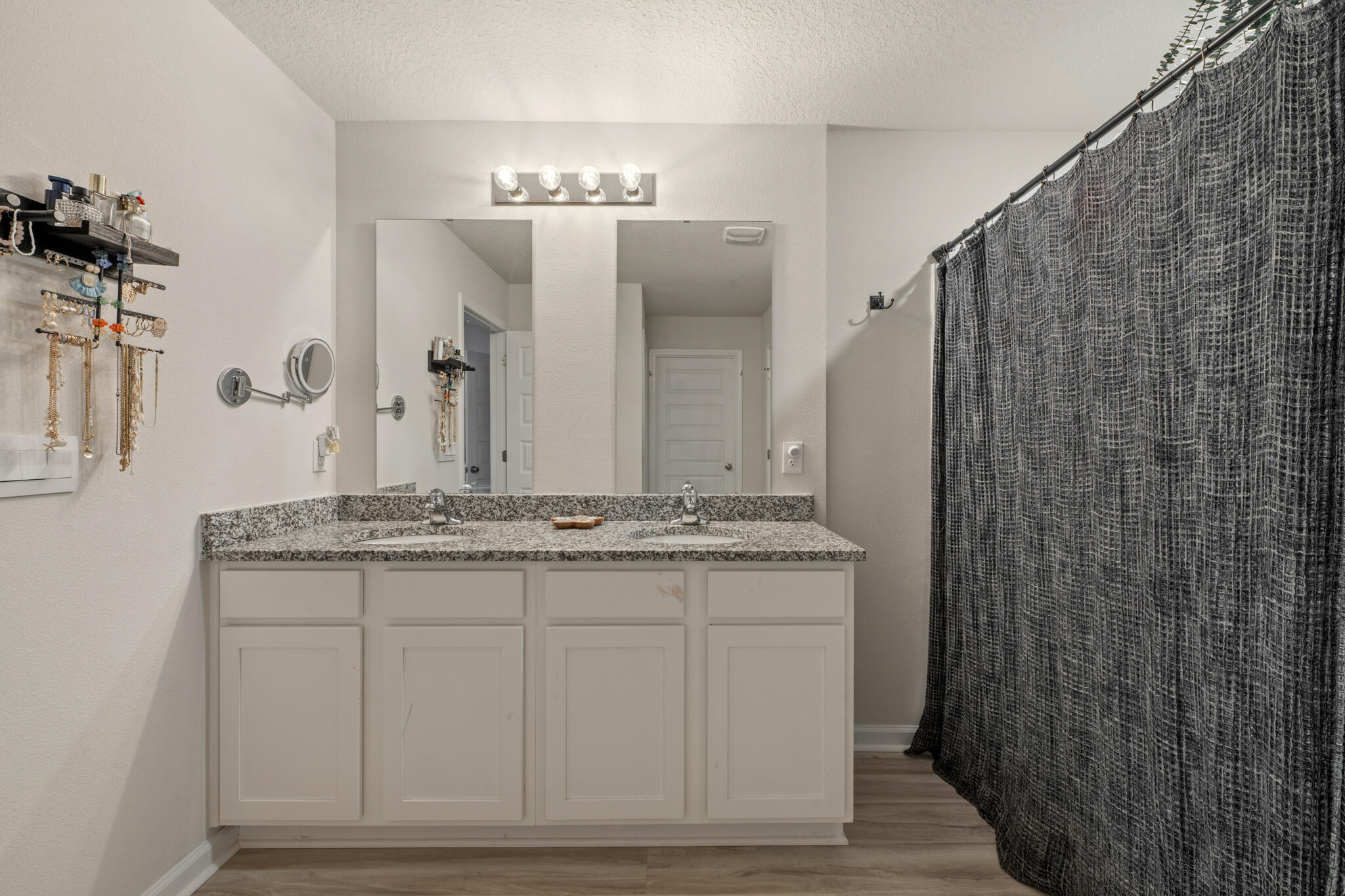 810 Otto Loop Crestview, FL 32539 - Photo 26 of 41 a en suite bathroom with a granite countertop sink a mirror and a shower