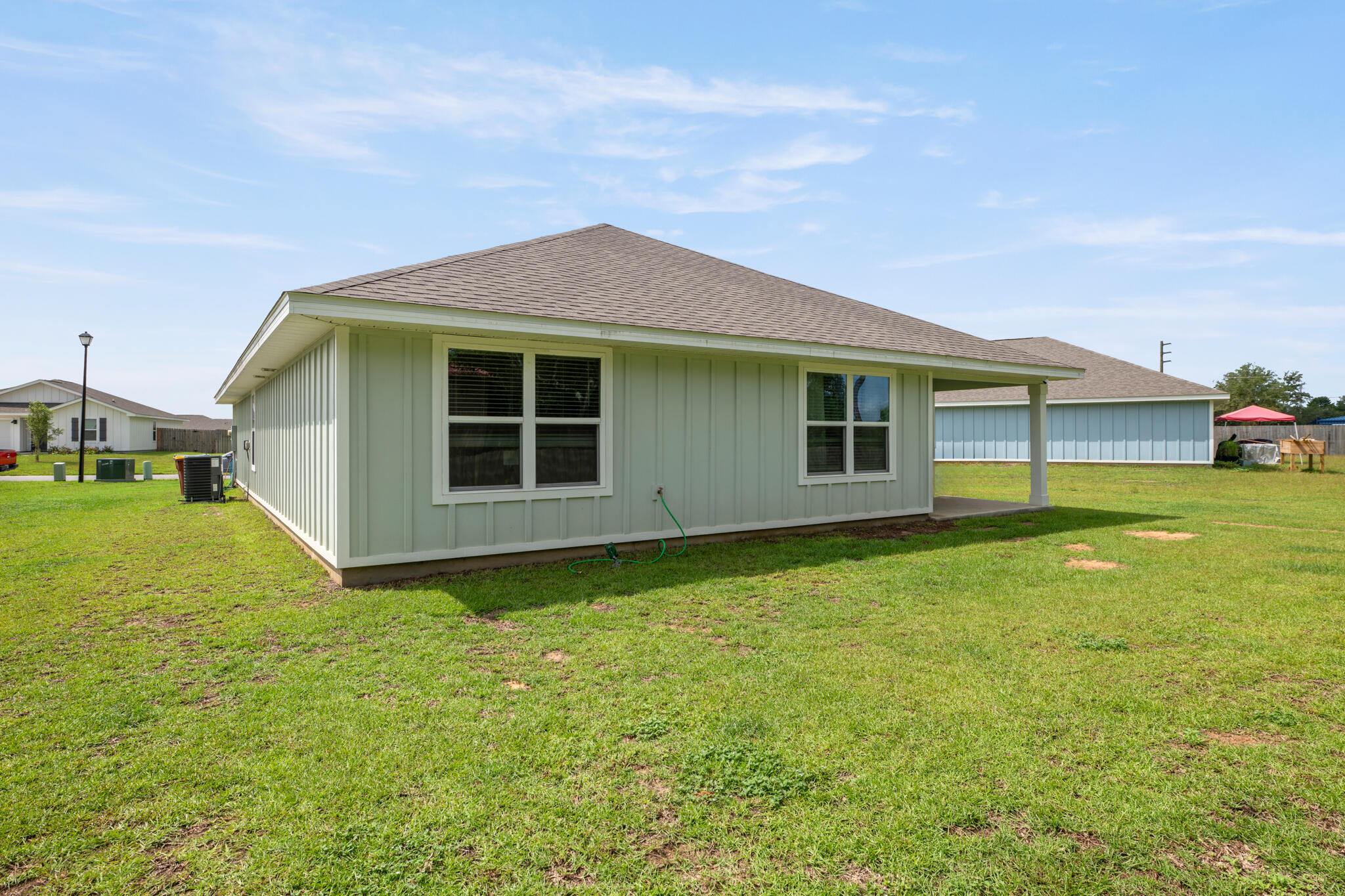 810 Otto Loop Crestview, FL 32539 - Photo 32 of 41 a view of an house with backyard space and balcony
