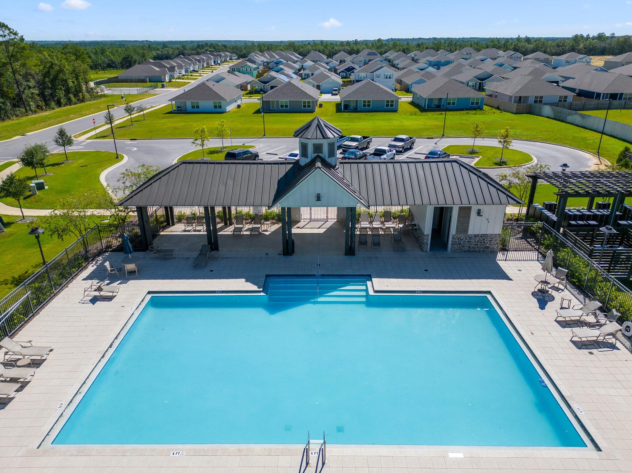 810 Otto Loop Crestview, FL 32539 - Photo 39 of 41 a swimming pool with outdoor seating and yard