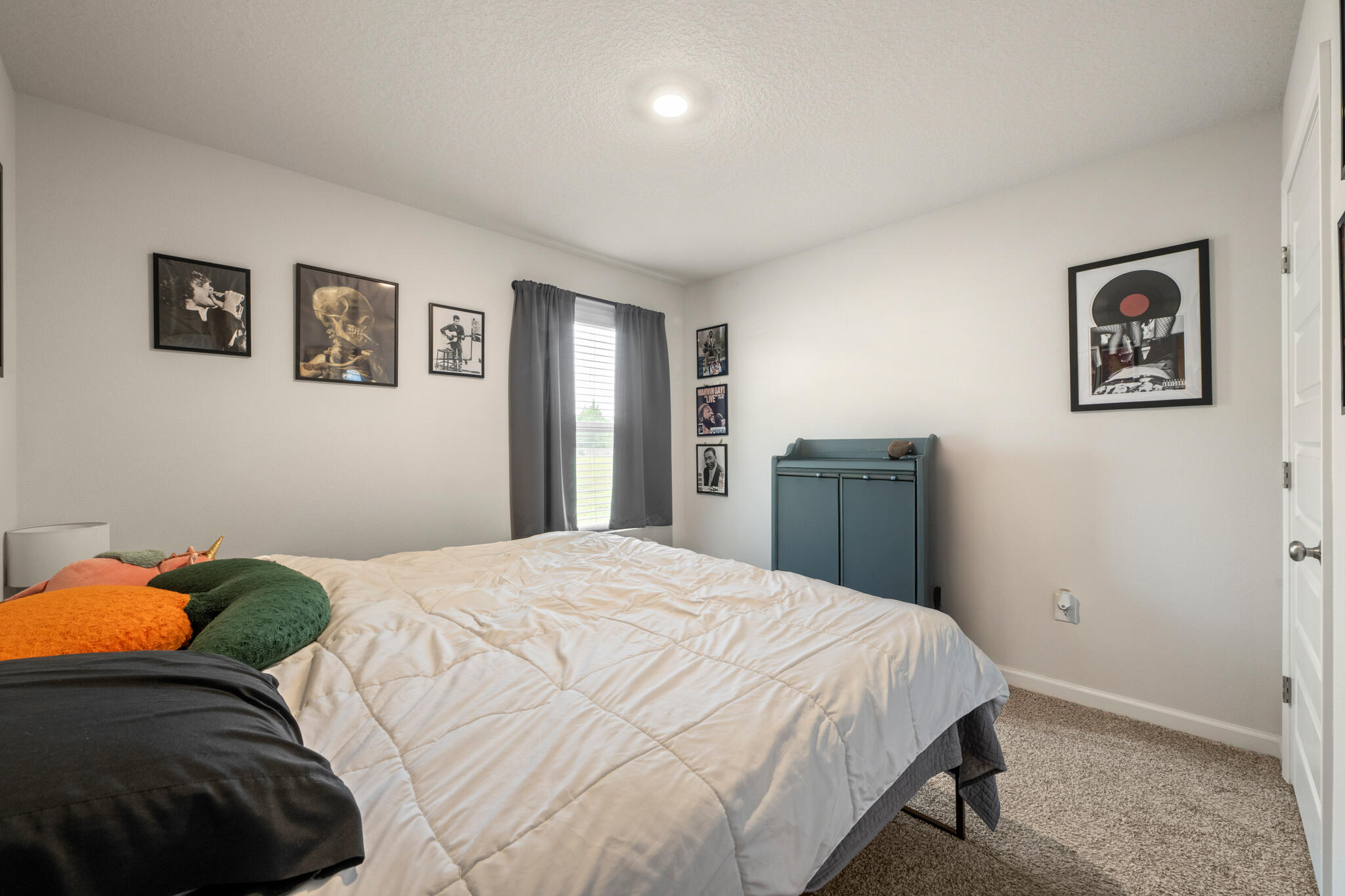 810 Otto Loop Crestview, FL 32539 - Photo 7 of 41 a bedroom with a bed and painting on the wall