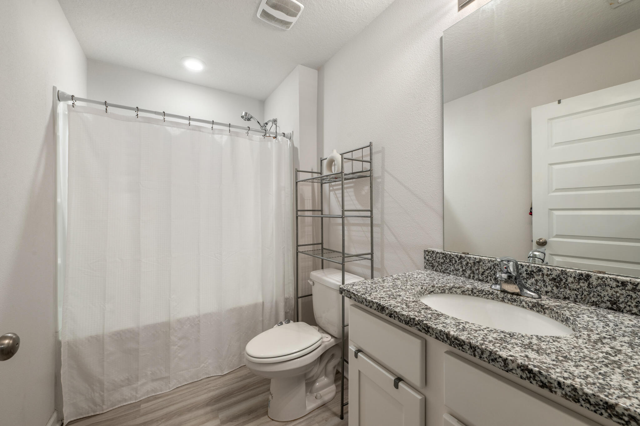 810 Otto Loop Crestview, FL 32539 - Photo 9 of 41 a bathroom with a granite countertop sink toilet and shower