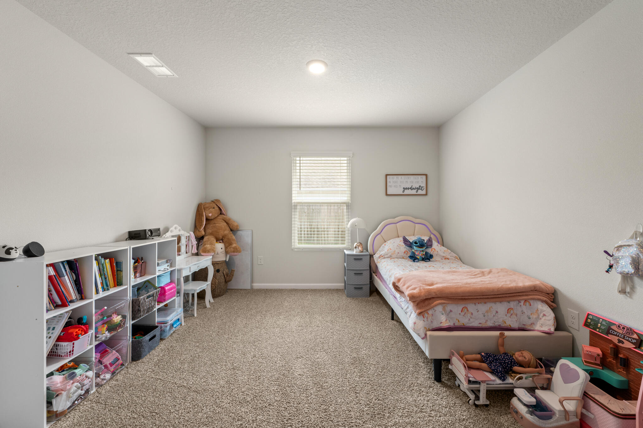 810 Otto Loop Crestview, FL 32539 - Photo 10 of 41 a bedroom with furniture and a book shelf