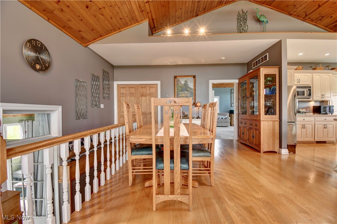 85530 Beagle Club Road Scio, OH 43988 - Photo 19 of 49 Dining space featuring light wood-style flooring, wood ceiling, and high vaulted ceiling