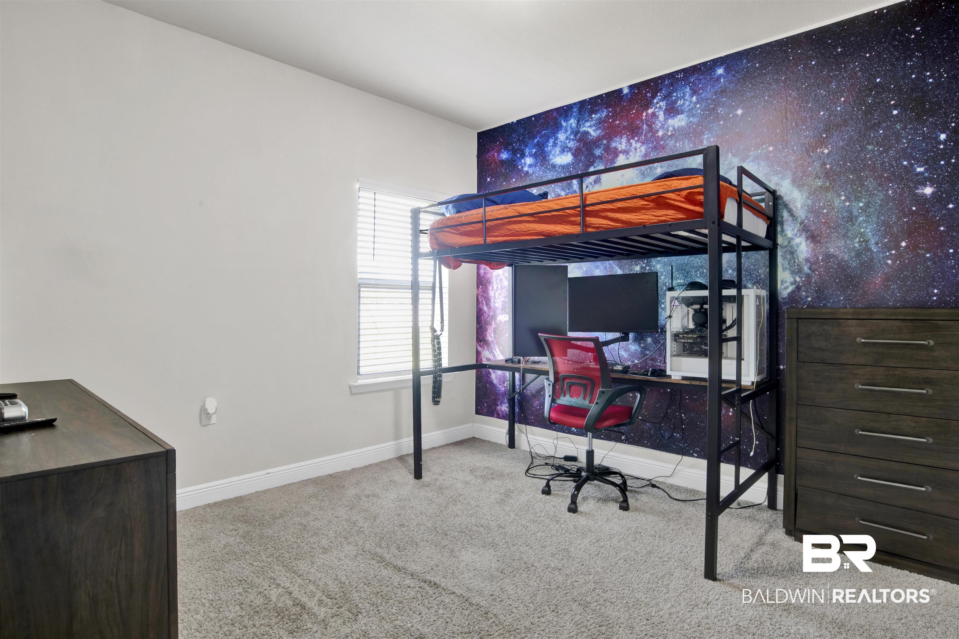 24253 Alydar Loop Daphne, AL 36526 - Photo 21 of 44 Bedroom featuring a desk, light carpet, and an accent wall