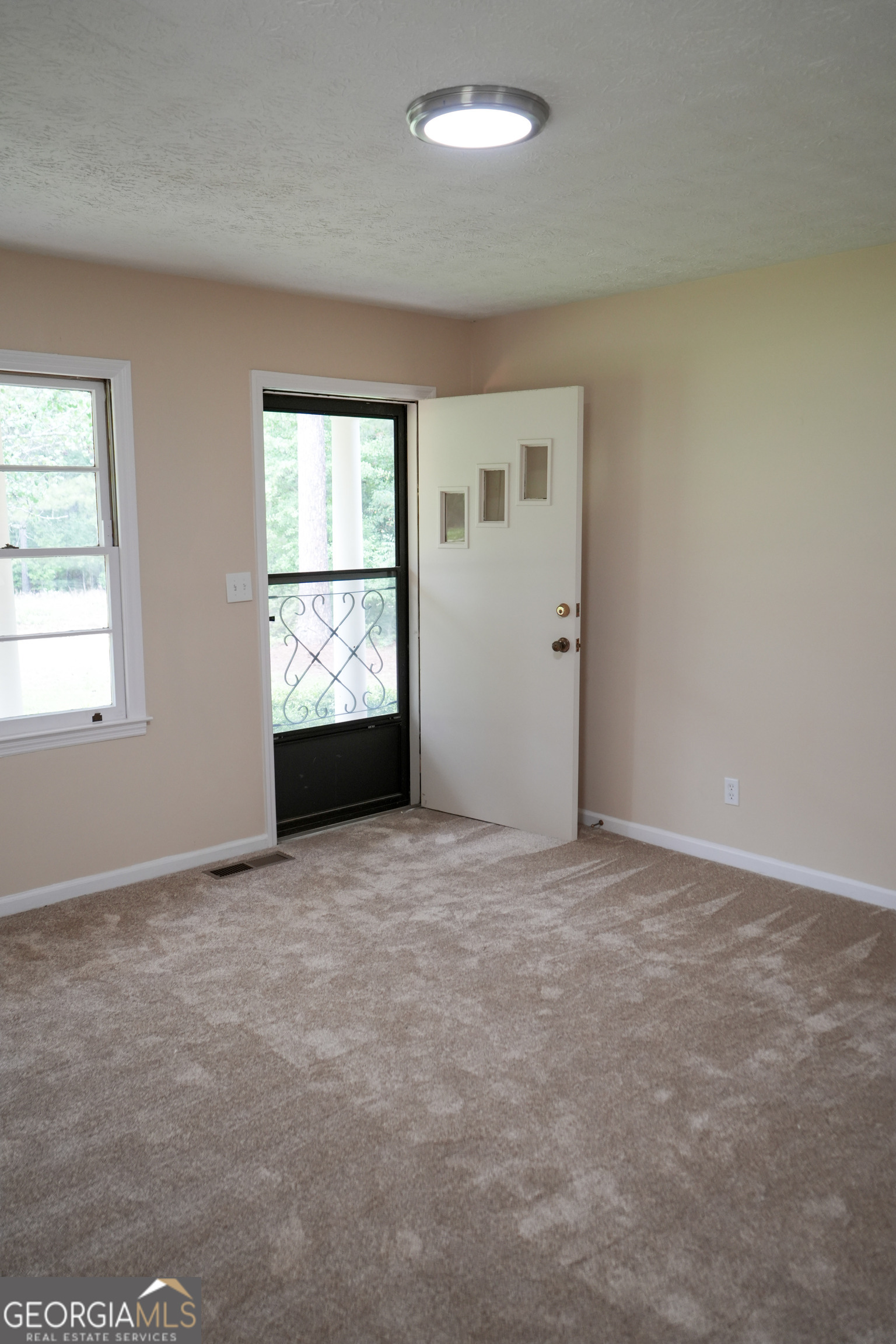 1869 Minter Blue Springs Road Rockledge, GA 30454 - Photo 19 of 45 an empty room with windows