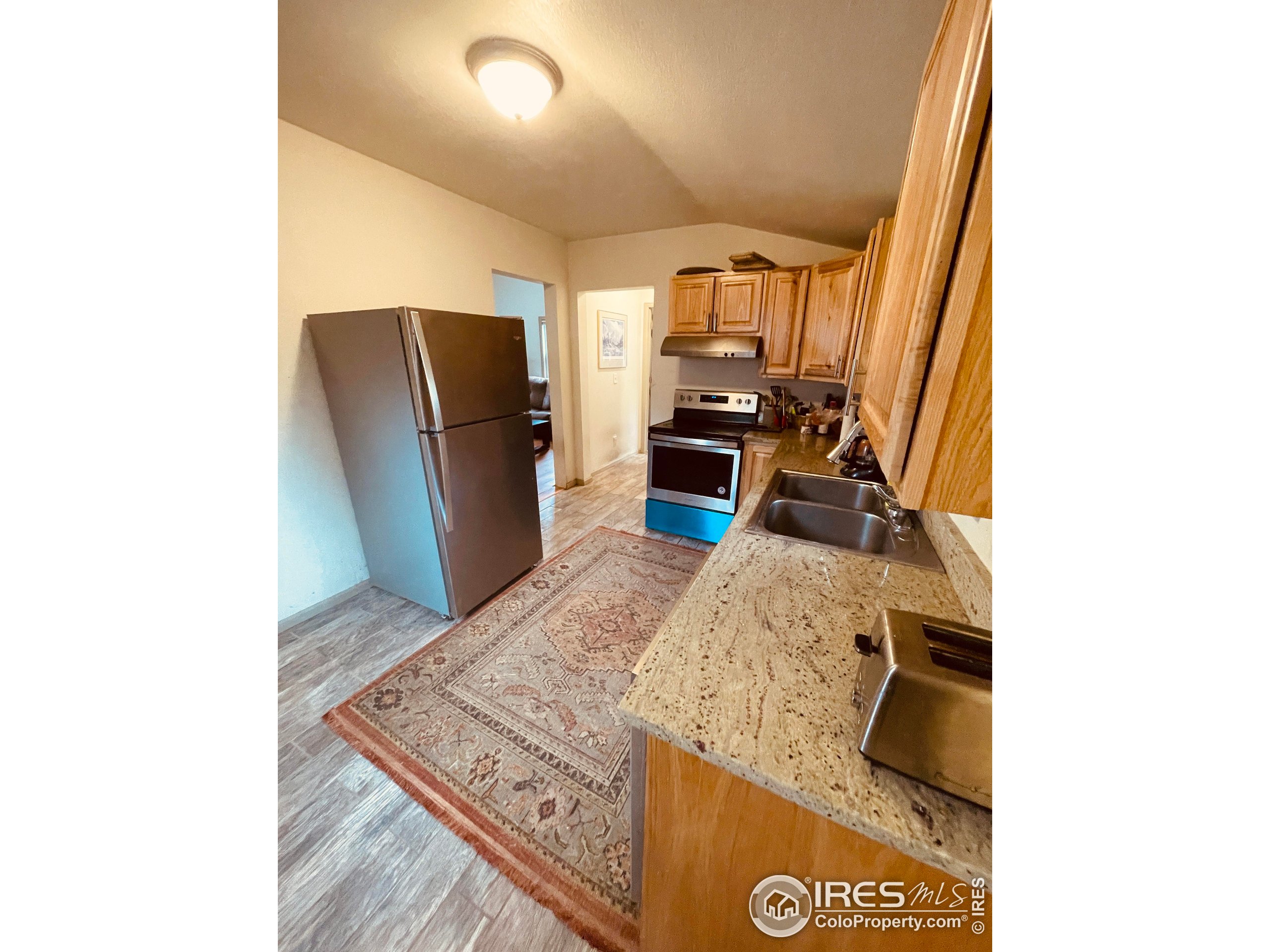 470 West Spring Street Nederland, CO 80466 - Photo 6 of 19 a living room with furniture and a flat screen tv