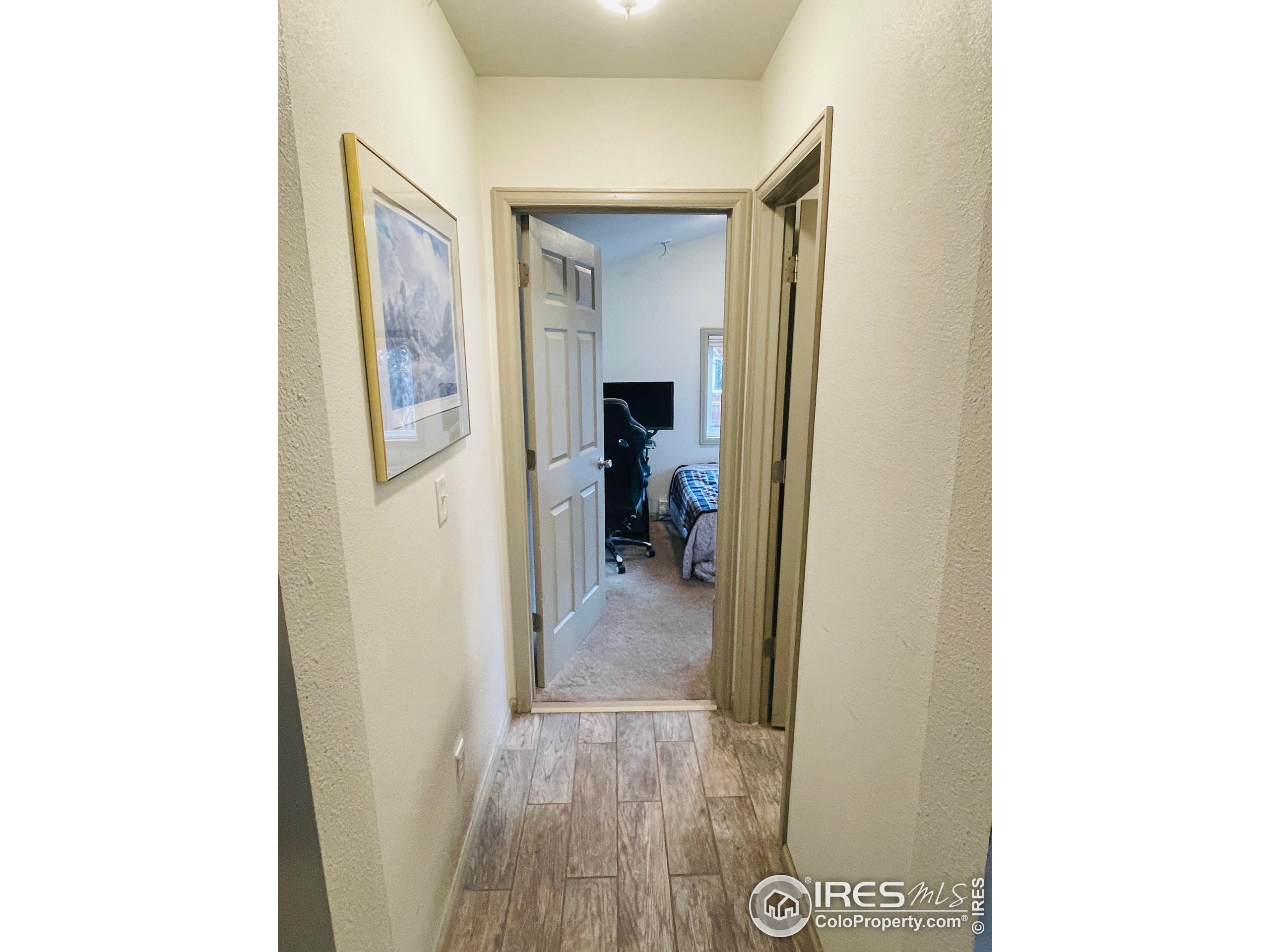 470 West Spring Street Nederland, CO 80466 - Photo 10 of 19 a view of a hallway with wooden floor