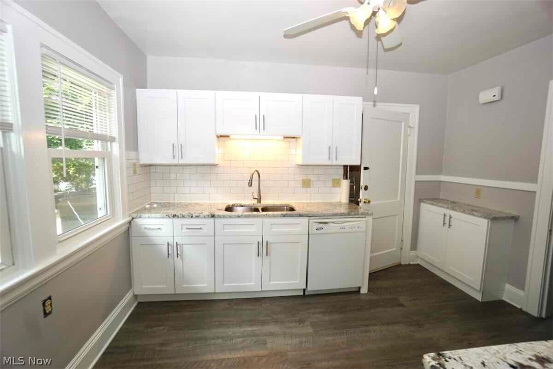 2168 Edgewood Road Cleveland, OH 44118 - Photo 21 of 41 2nd fl kitchen with dishwasher, ceiling fan, white cabinetry, "Lifeproof" flooring, and sink