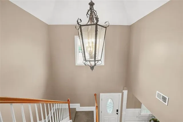 a spacious bedroom with a bed and a window