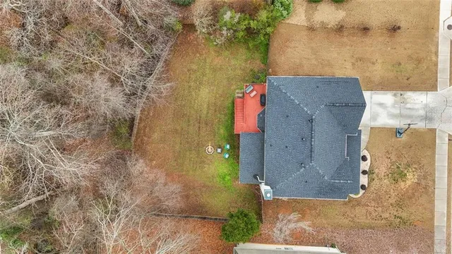 a aerial view of a house with a yard
