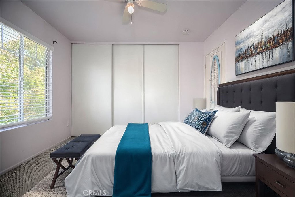 554 Pointe Vista Court Corona, CA 92881 - Photo 21 of 31 a bedroom with a bed and window