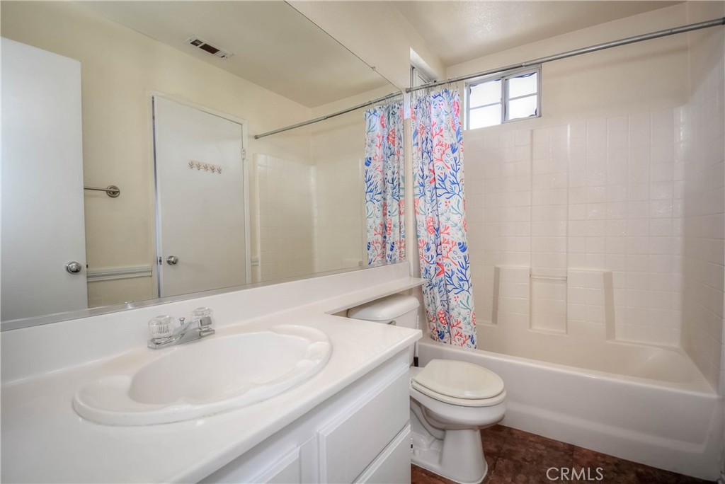 554 Pointe Vista Court Corona, CA 92881 - Photo 24 of 31 a bathroom with a sink a toilet and shower