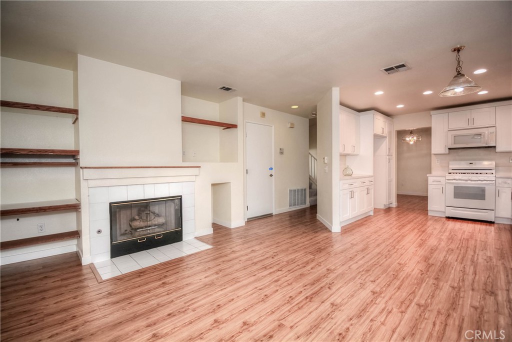 554 Pointe Vista Court Corona, CA 92881 - Photo 9 of 31 a view of kitchen with furniture and wooden floor