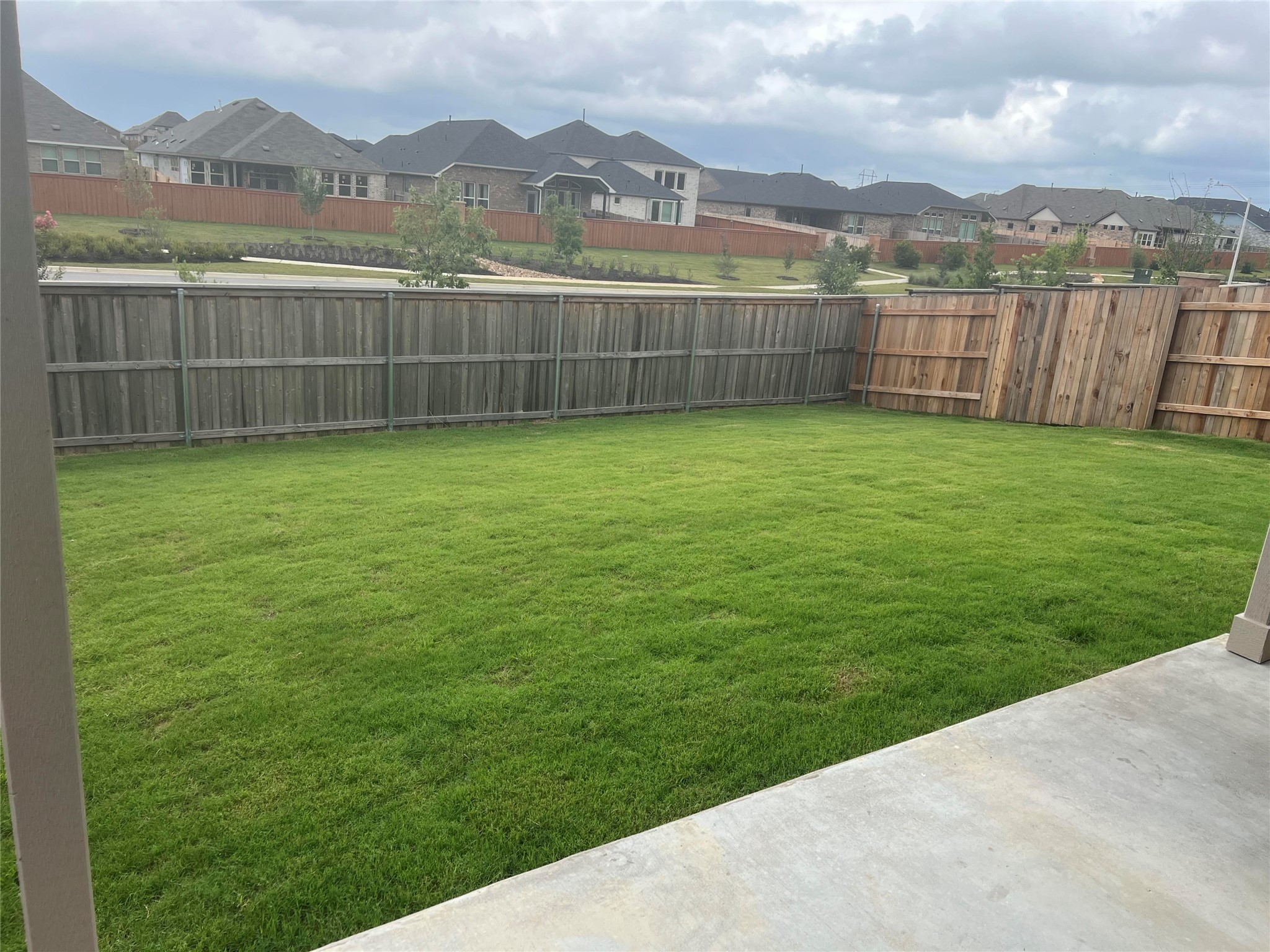 427 Tree Nut Loop Buda, TX 78610 - Photo 31 of 38 a view of a yard with a lake view