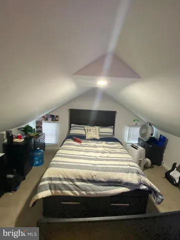 a bedroom with a bed and a walk in closet