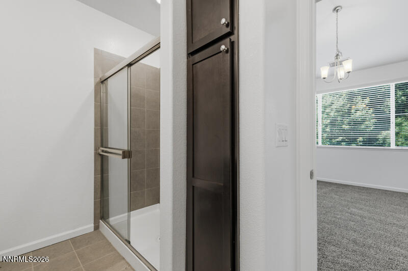 285 Mark Jeffrey Lane Reno, NV 89503 - Photo 16 of 20 a bathroom with a glass shower door