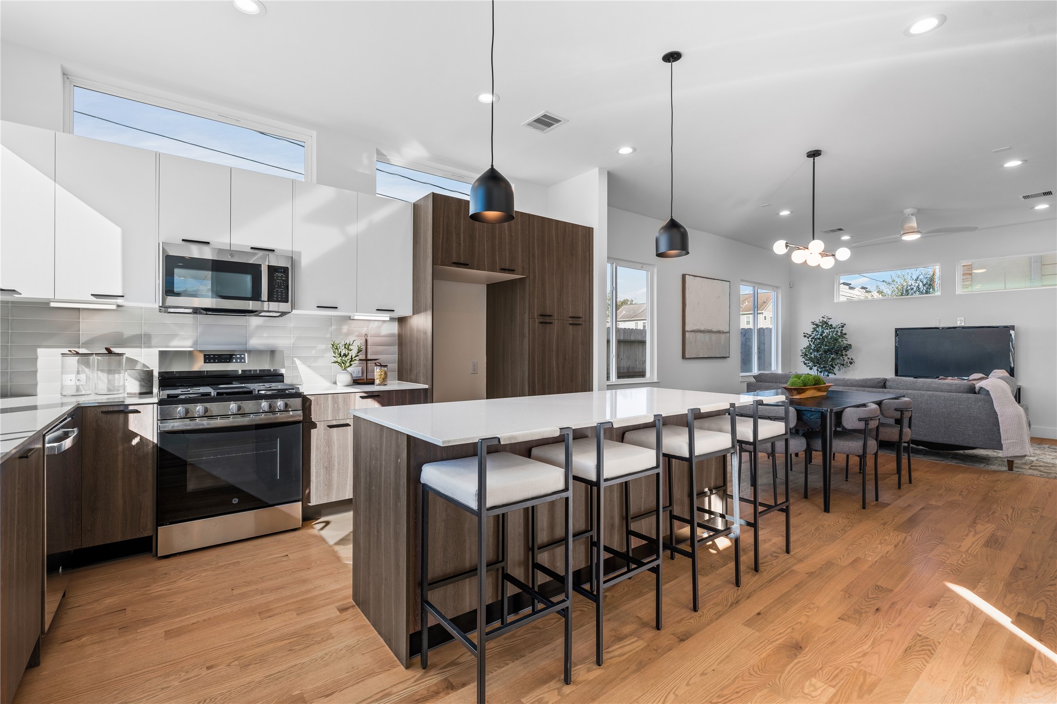 5404 Mulvey Street Houston, TX 77020 - Photo 6 of 28 a kitchen with stainless steel appliances granite countertop a stove a refrigerator a oven a sink with a dining table and chairs