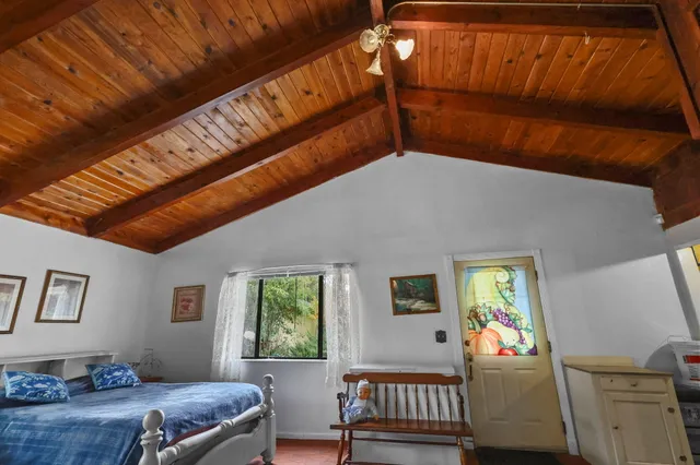 a bedroom with furniture and a window