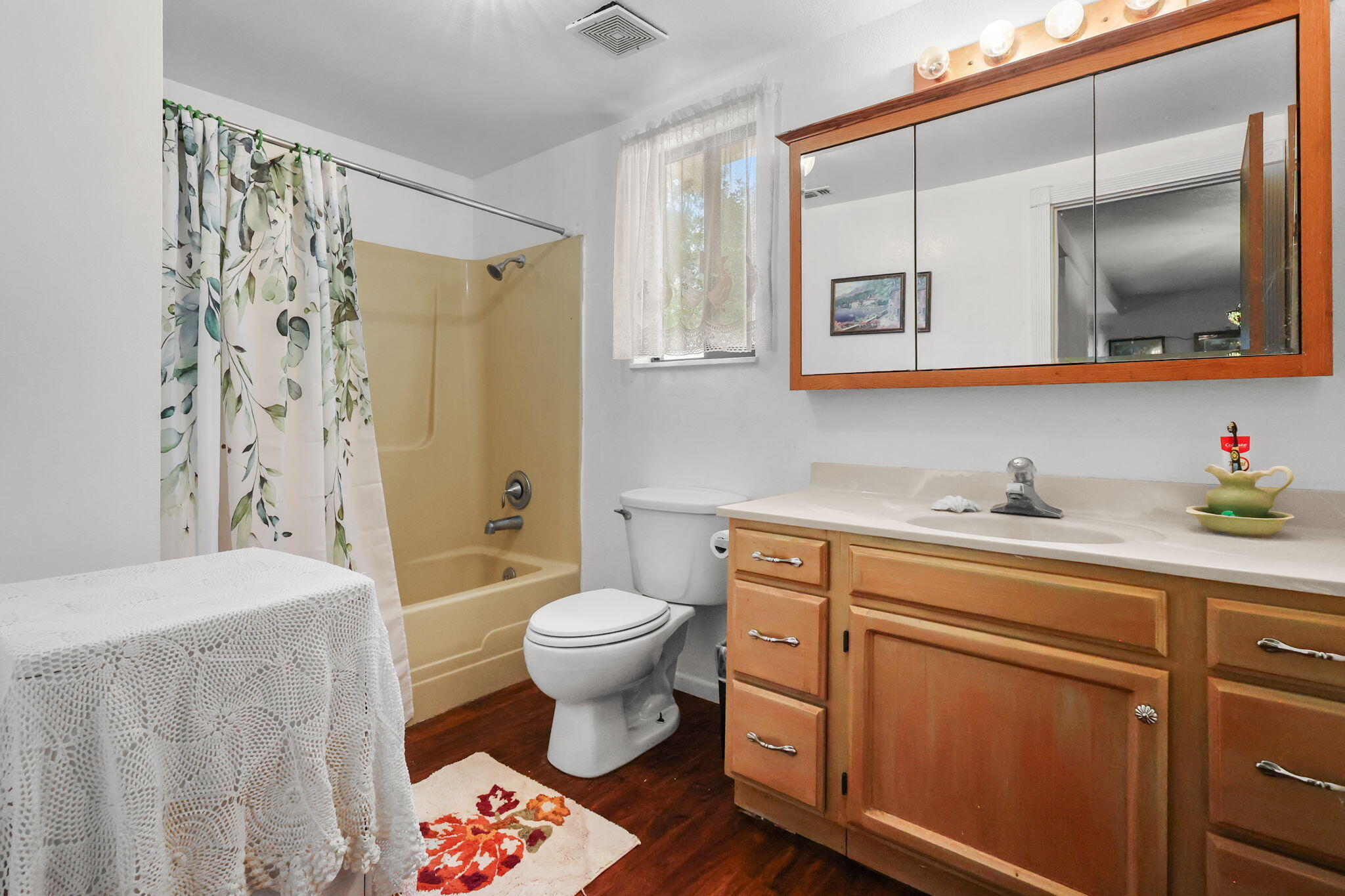 18385 Bowman Road Cottonwood, CA 96022 - Photo 14 of 39 a spacious bathroom with a sink toilet a mirror and shower