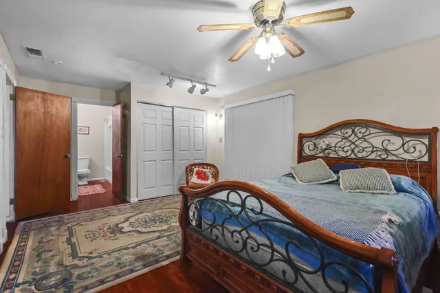 a bedroom with furniture and a chandelier