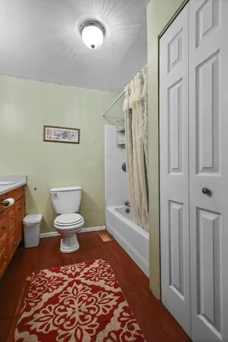 a bathroom with a toilet a sink and a shower