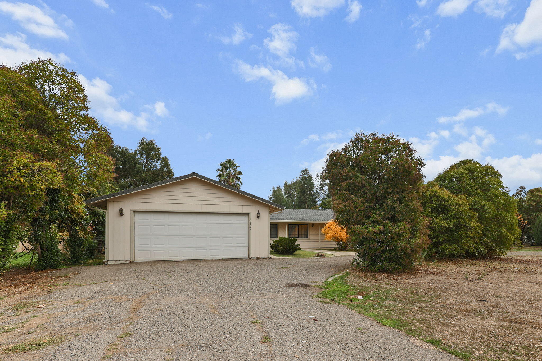 18385 Bowman Road Cottonwood, CA 96022 - Photo 25 of 39 a front view of a house with a yard and garage