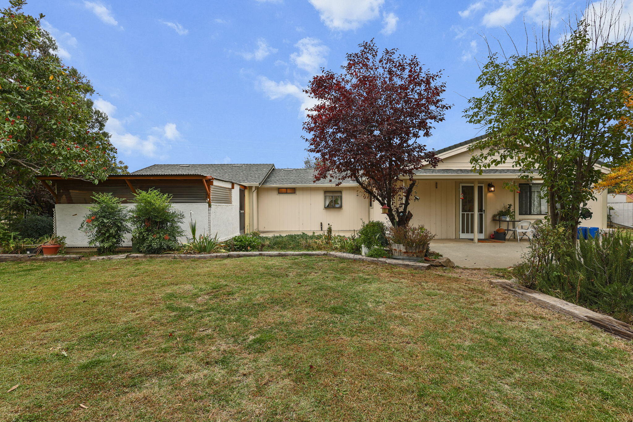 18385 Bowman Road Cottonwood, CA 96022 - Photo 30 of 39 front view of a house with a yard