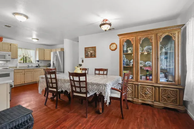 a view of a dining room with furniture window and wooden floor