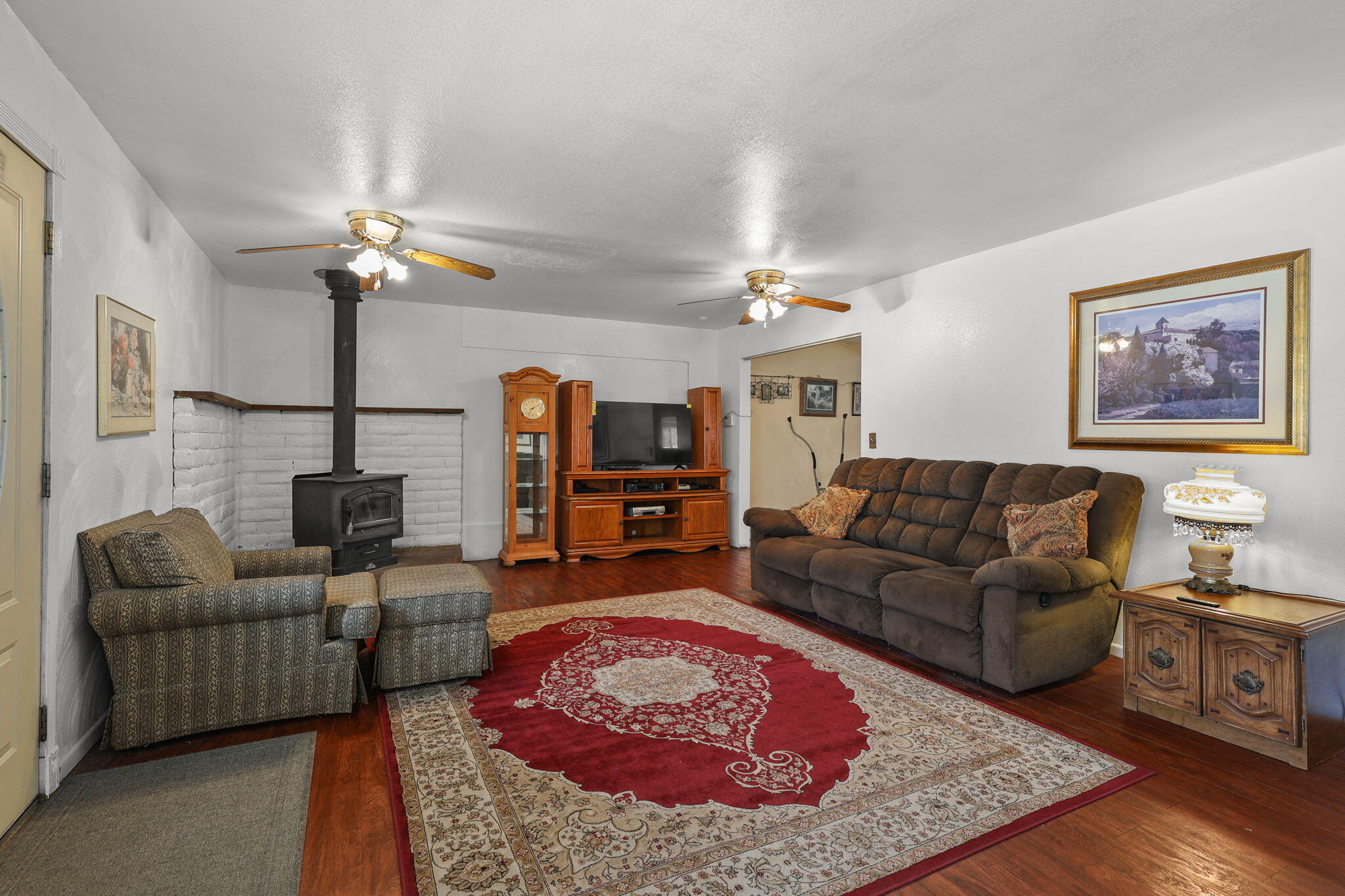 18385 Bowman Road Cottonwood, CA 96022 - Photo 8 of 39 a living room with furniture and a fireplace