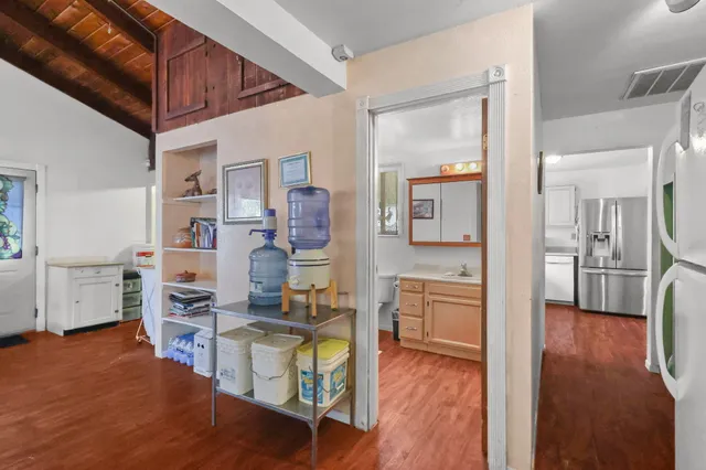 a room with furniture and wooden floor