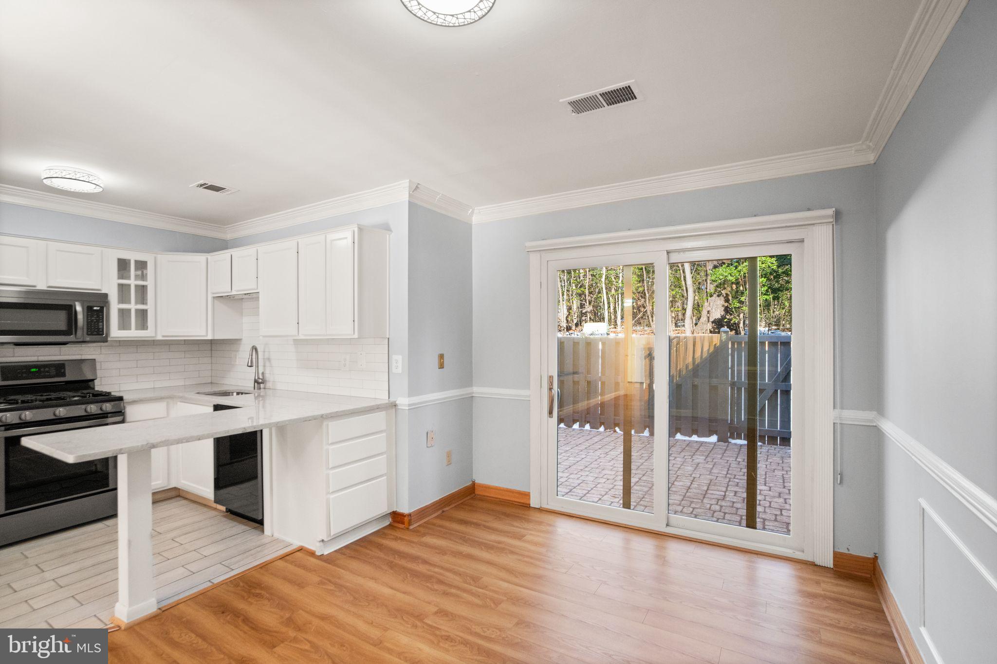 2266 Coppersmith Square Reston, VA 20191 - Photo 14 of 42 Dining space with rear patio access