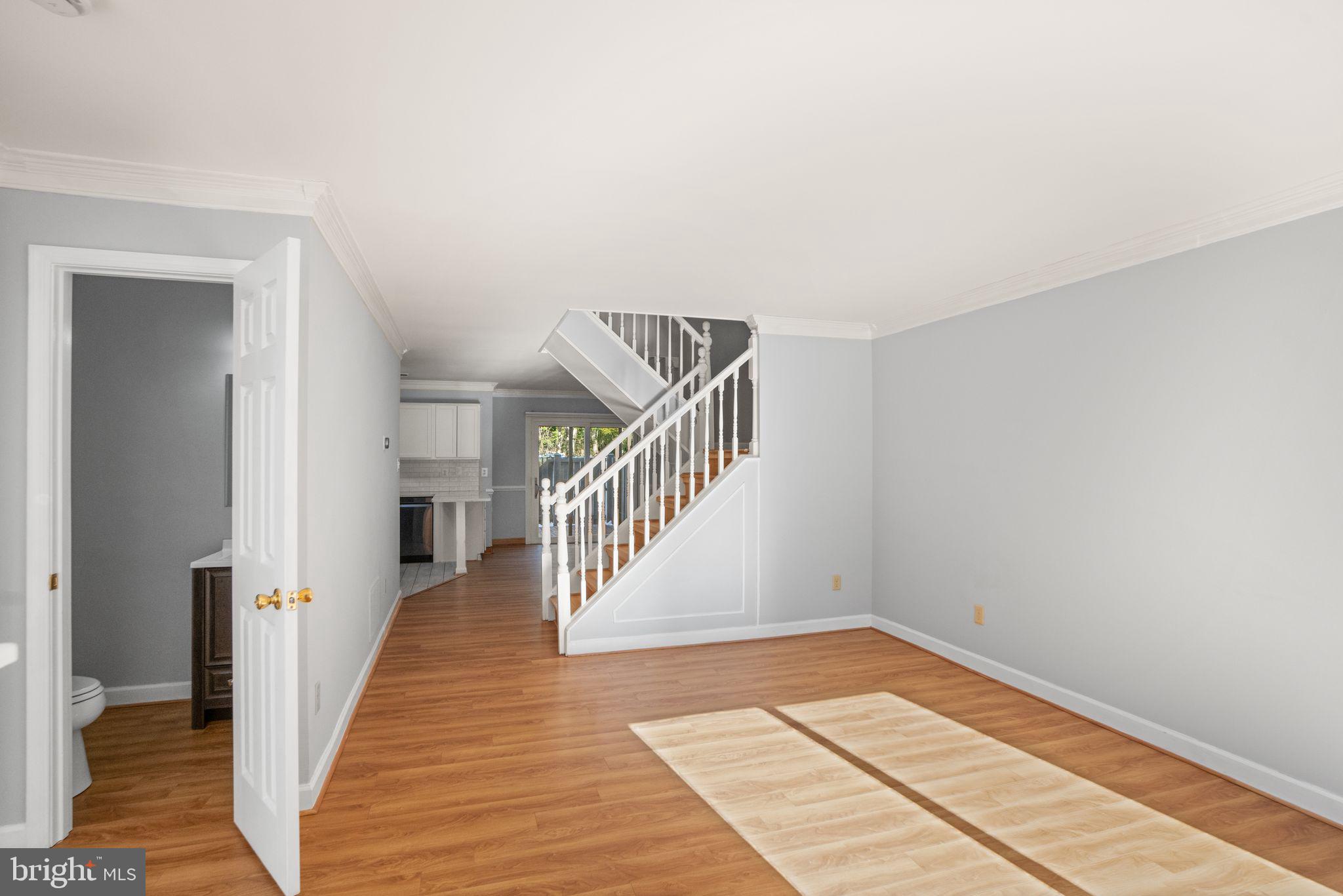 2266 Coppersmith Square Reston, VA 20191 - Photo 7 of 42 View to the living space and powder room