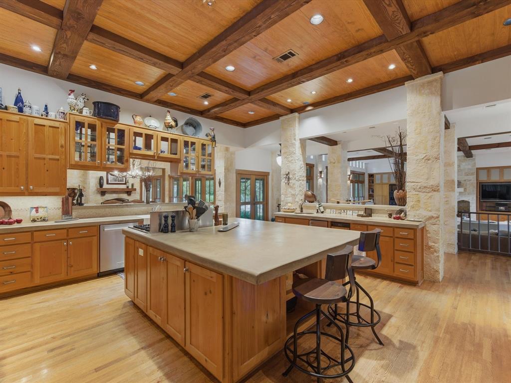151 Trinity Bluffs Road Aledo, TX 76008 - Photo 14 of 40 a kitchen with stainless steel appliances granite countertop a sink and cabinets