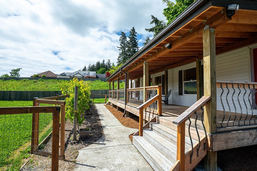 1815 Newman Road Freeland, WA 98249 - Photo 2 of 26 a view of a balcony with wooden floor and wooden fence