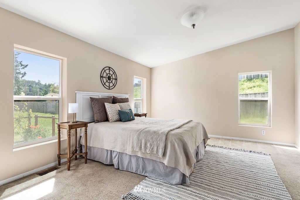 1815 Newman Road Freeland, WA 98249 - Photo 12 of 26 a bedroom with a bed and window