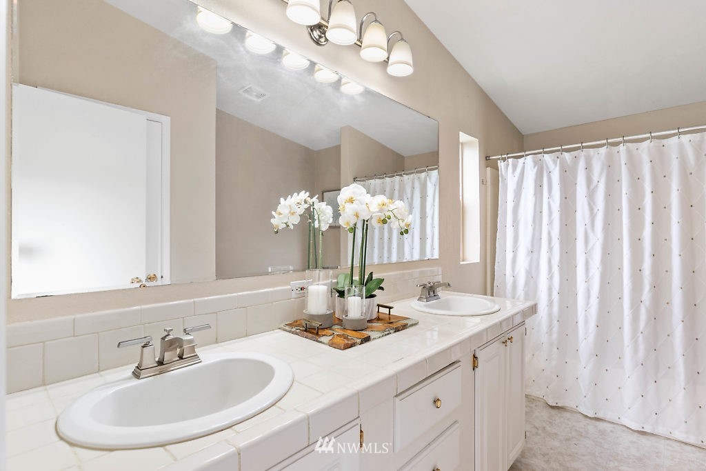 1815 Newman Road Freeland, WA 98249 - Photo 14 of 26 a bathroom with a sink and a mirror