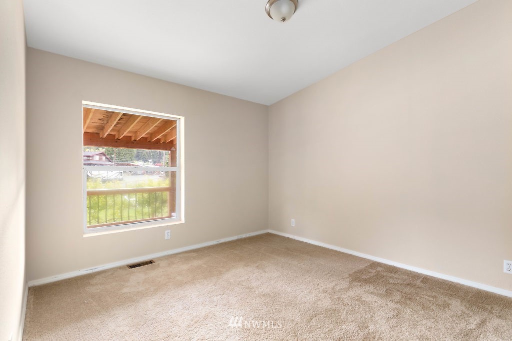 1815 Newman Road Freeland, WA 98249 - Photo 17 of 26 an empty room with a window