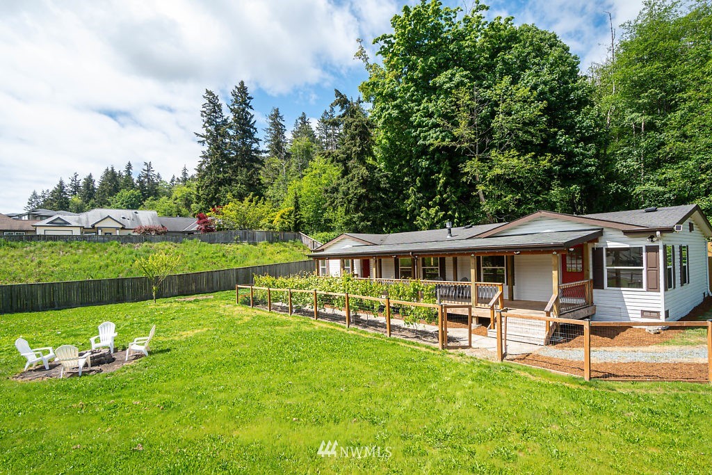 1815 Newman Road Freeland, WA 98249 - Photo 24 of 26 a view of a house with a backyard patio and swimming pool