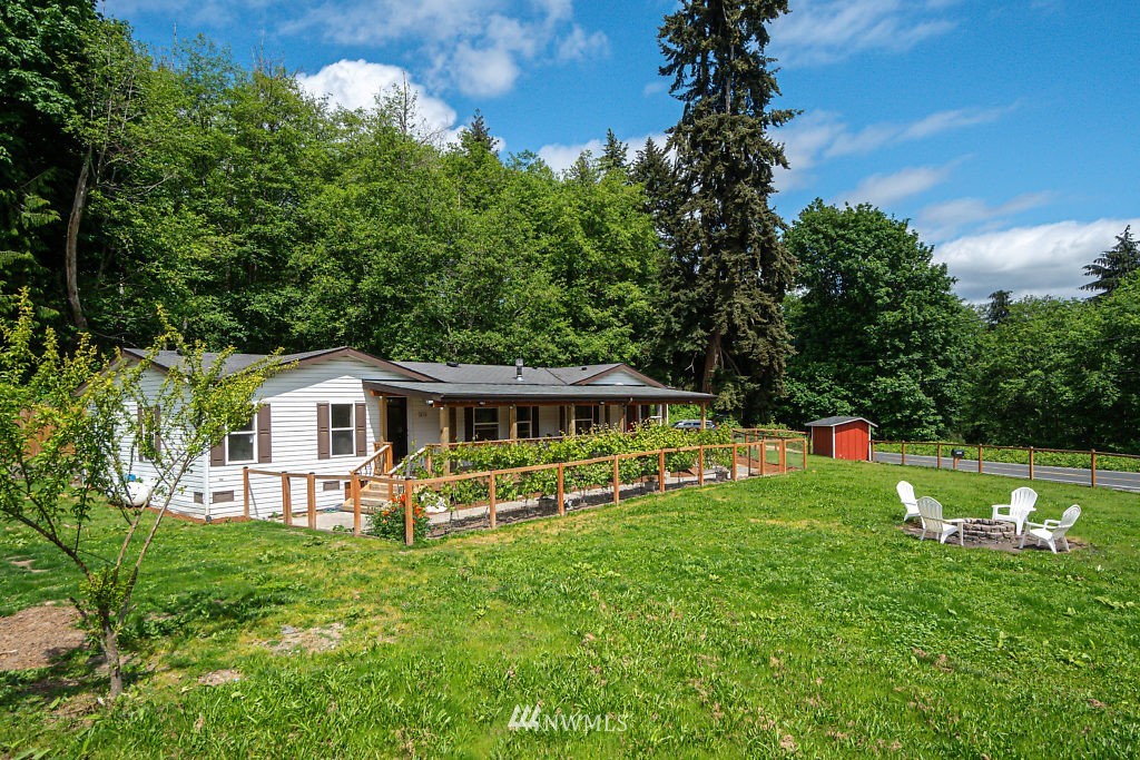1815 Newman Road Freeland, WA 98249 - Photo 25 of 26 a front view of a house with garden