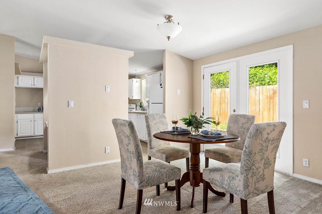1815 Newman Road Freeland, WA 98249 - Photo 8 of 26 a view of a dining room with furniture and window