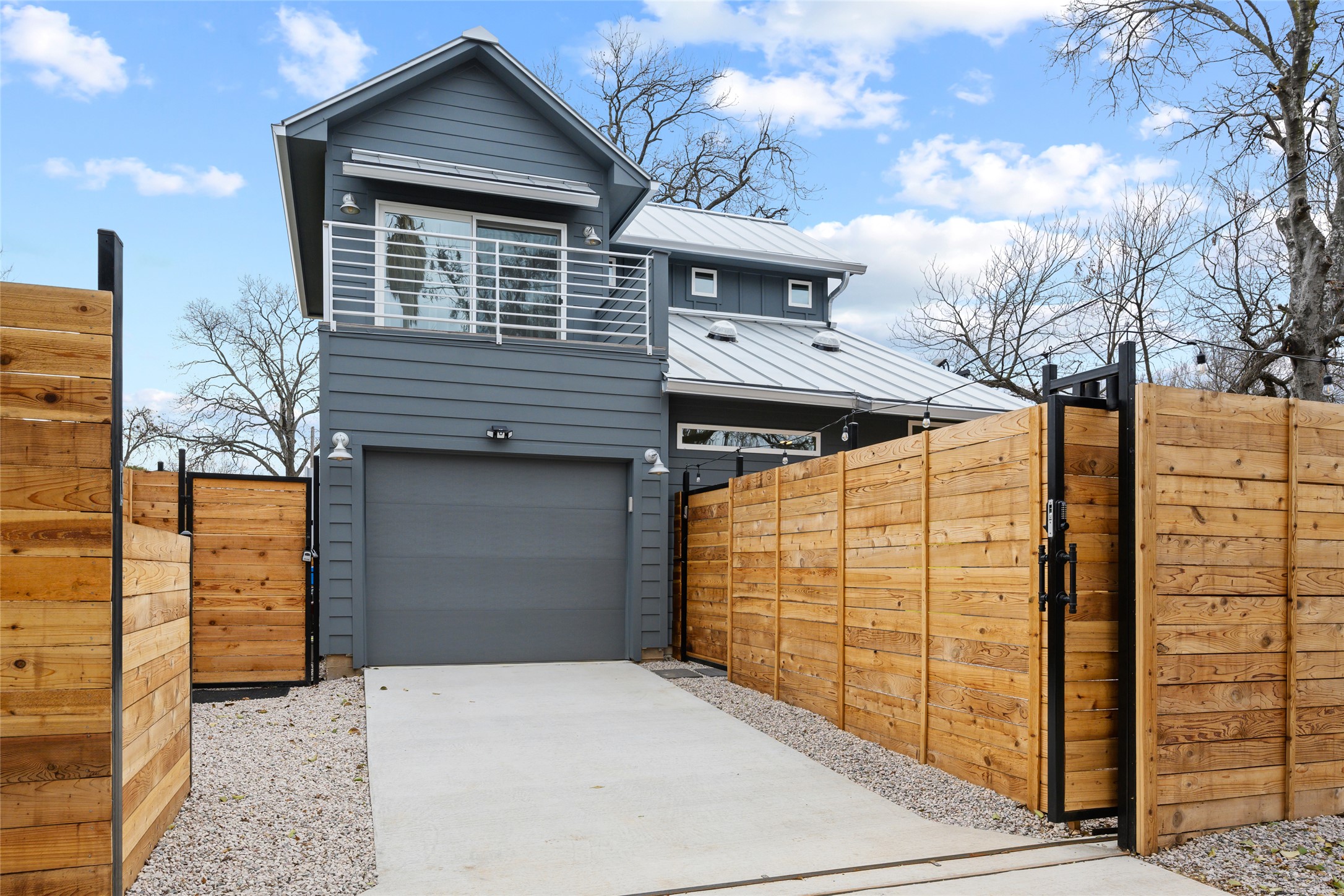 Experience East Austin energy in this upscale custom home with thoughtful details throughout. The garage features a 240V/50-amp EV charger and extra locked storage.