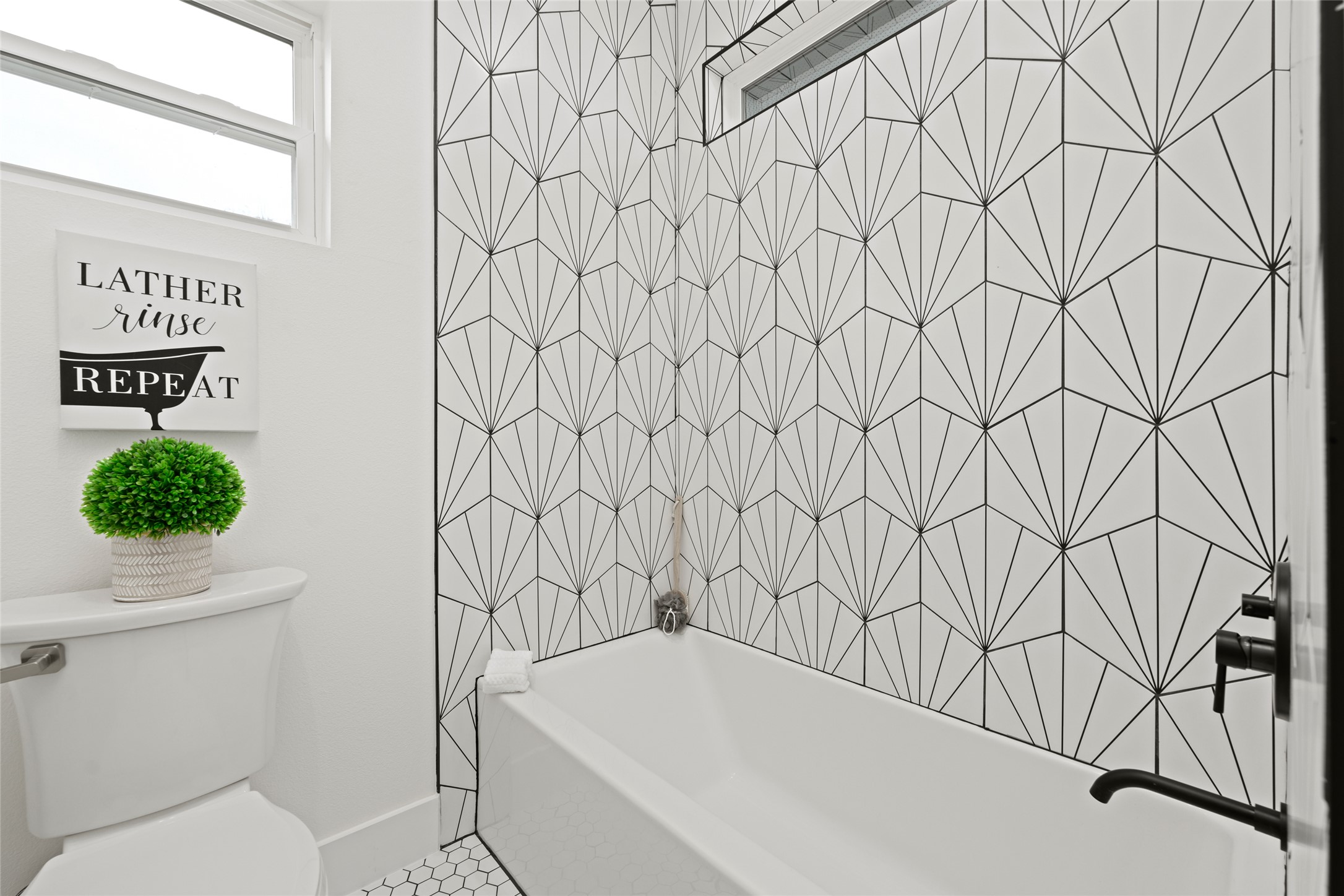 2102 East 2nd Street, Unit 2 Austin, TX 78702 - Photo 10 of 18 The bathroom features a shower / tub combo.