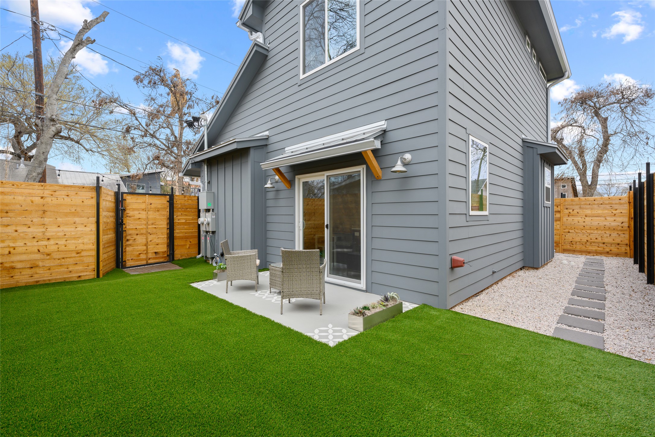 2102 East 2nd Street, Unit 2 Austin, TX 78702 - Photo 16 of 18 Xeriscaping and synthetic turf help to keep the outdoor spaces neat and low-maintenance.