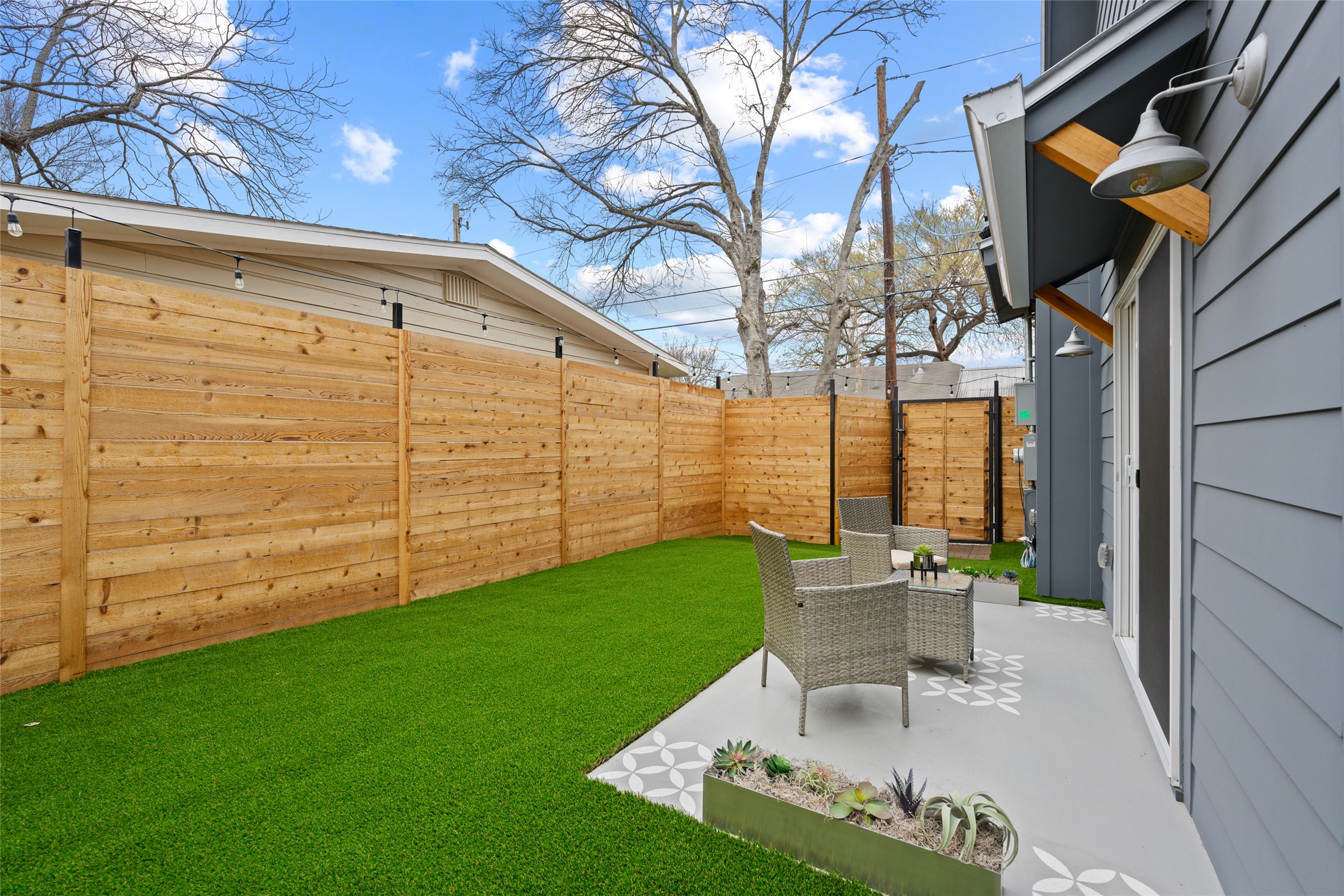2102 East 2nd Street, Unit 2 Austin, TX 78702 - Photo 2 of 18 The extra tall privacy fence ensures you and your guests have a comfortable place to relax and unwind.