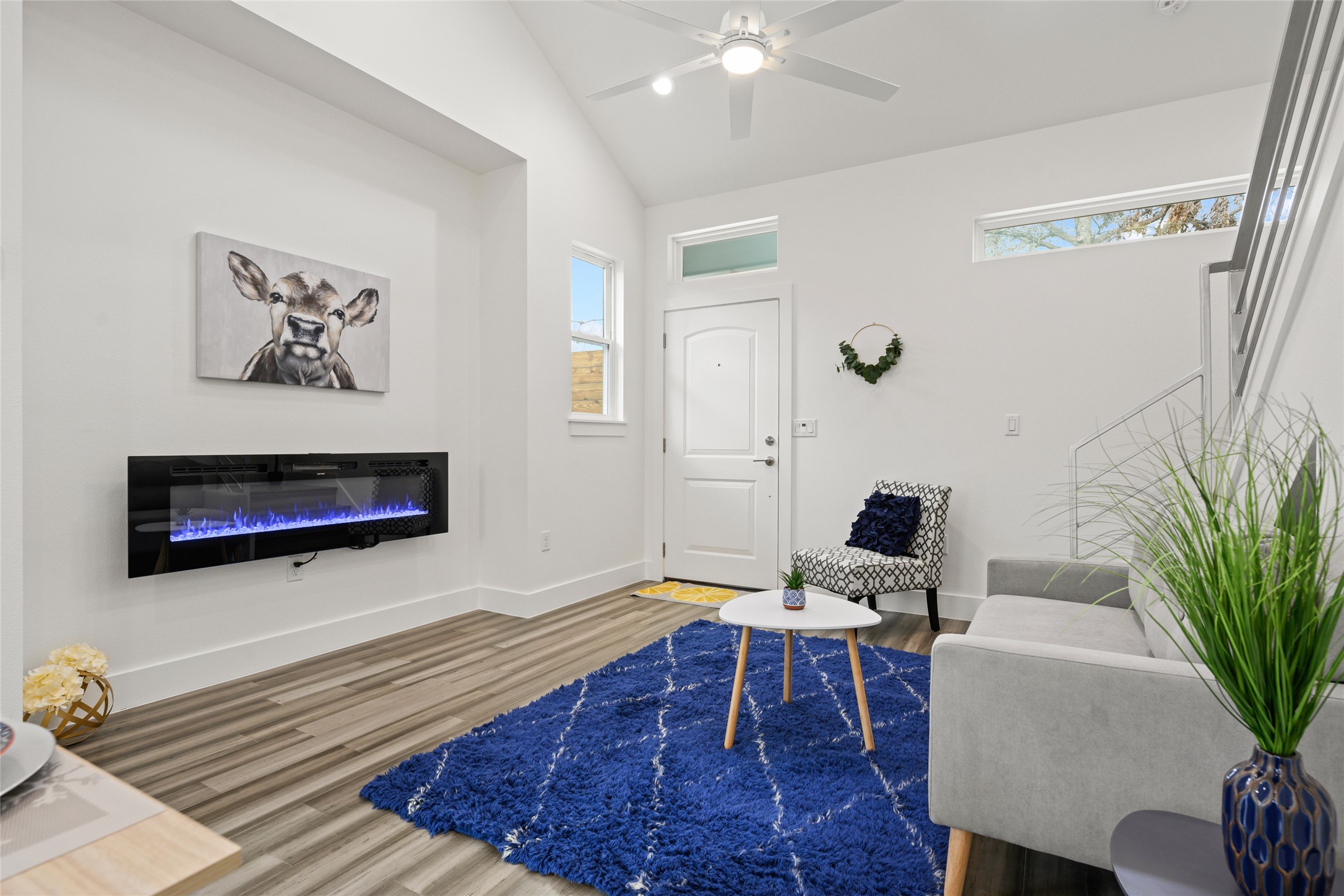 2102 East 2nd Street, Unit 2 Austin, TX 78702 - Photo 5 of 18 During the day the living room fills with natural light from the privacy windows on every wall. The electric fireplace makes the space even more special at night.
